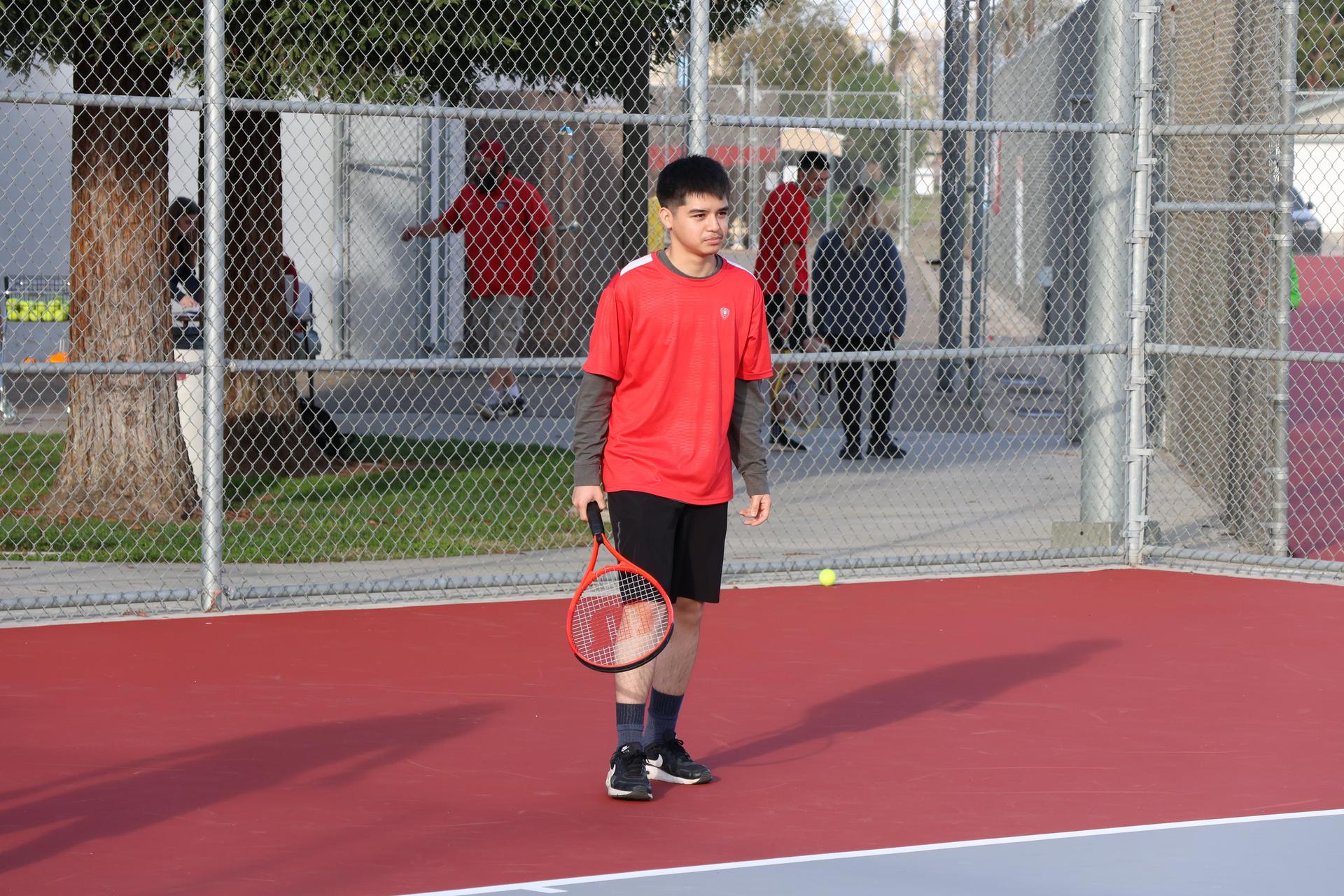 CUHS Boys playing tennis against coalinga