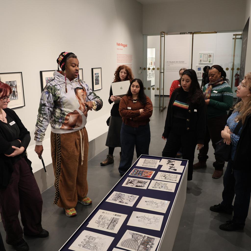 Group looking at art in center