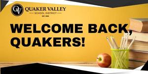 "Welcome Back, Quakers!" is superimposed over an image with a yellow background with a stack of books and an apple on a desk. The Quaker Valley School District logo is located in the top left corner.