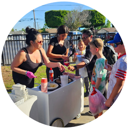 PTA volunteers serving treats