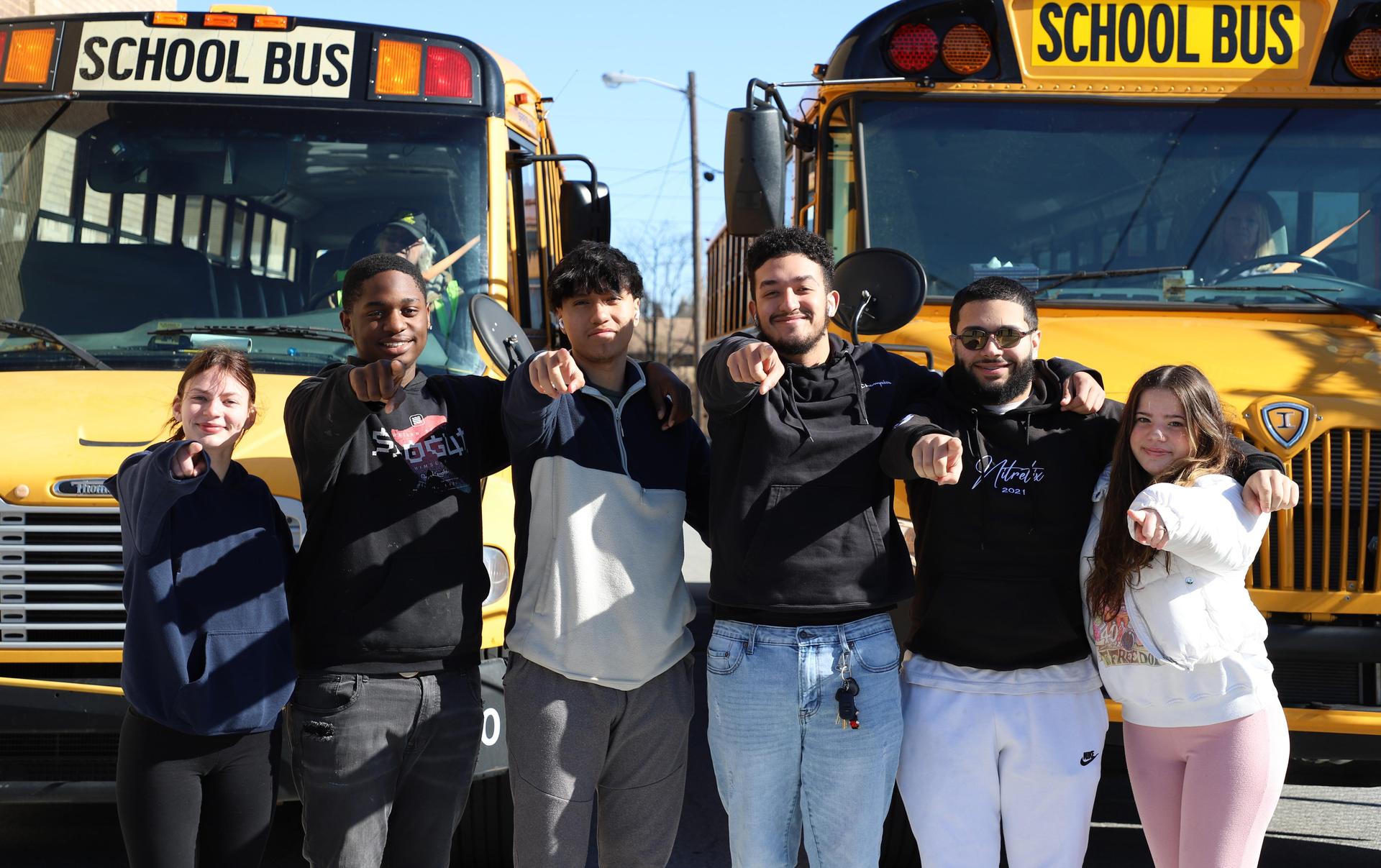 Students in front of a bus