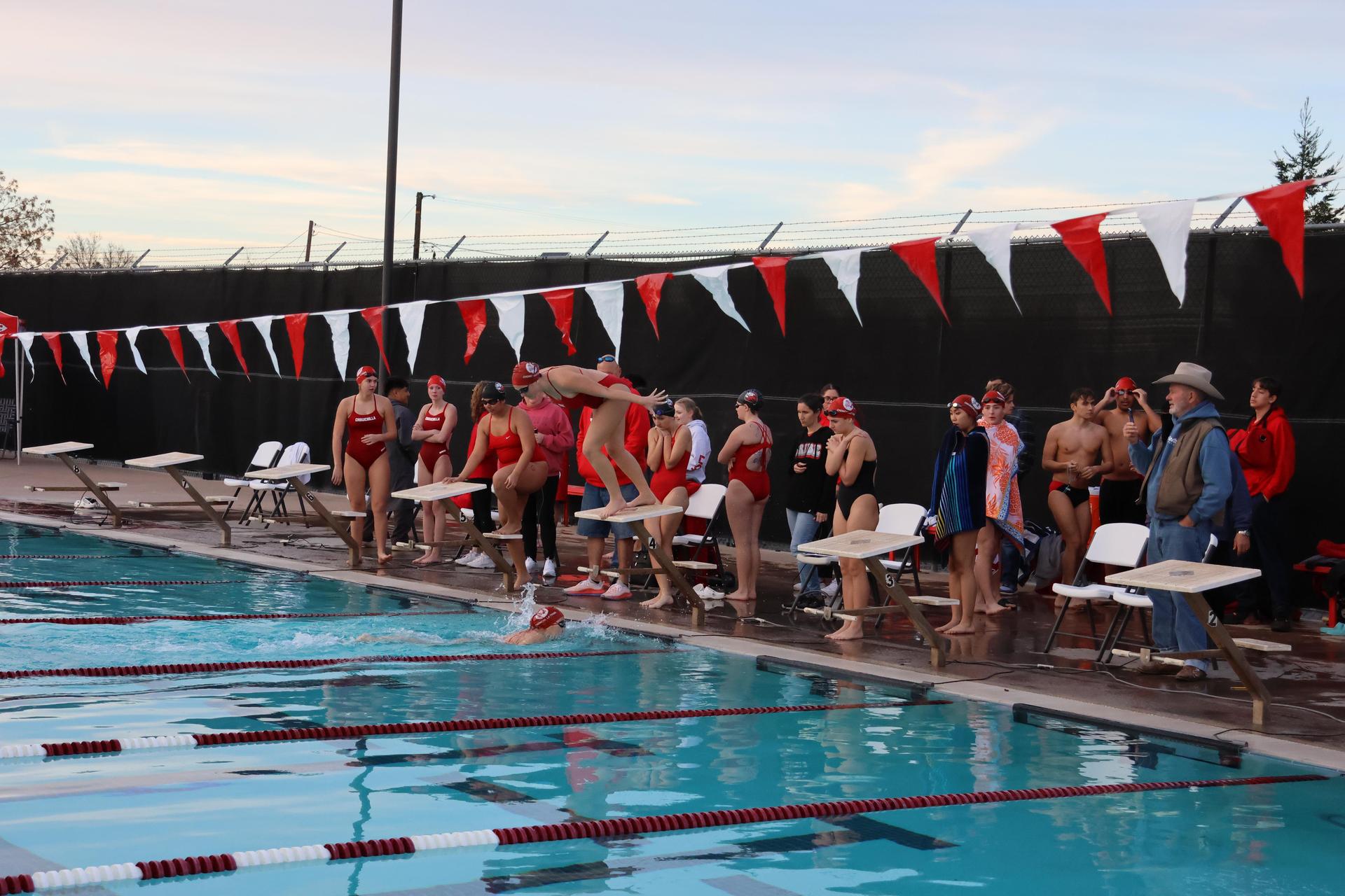 girls swimmers competing in the 400 free relay