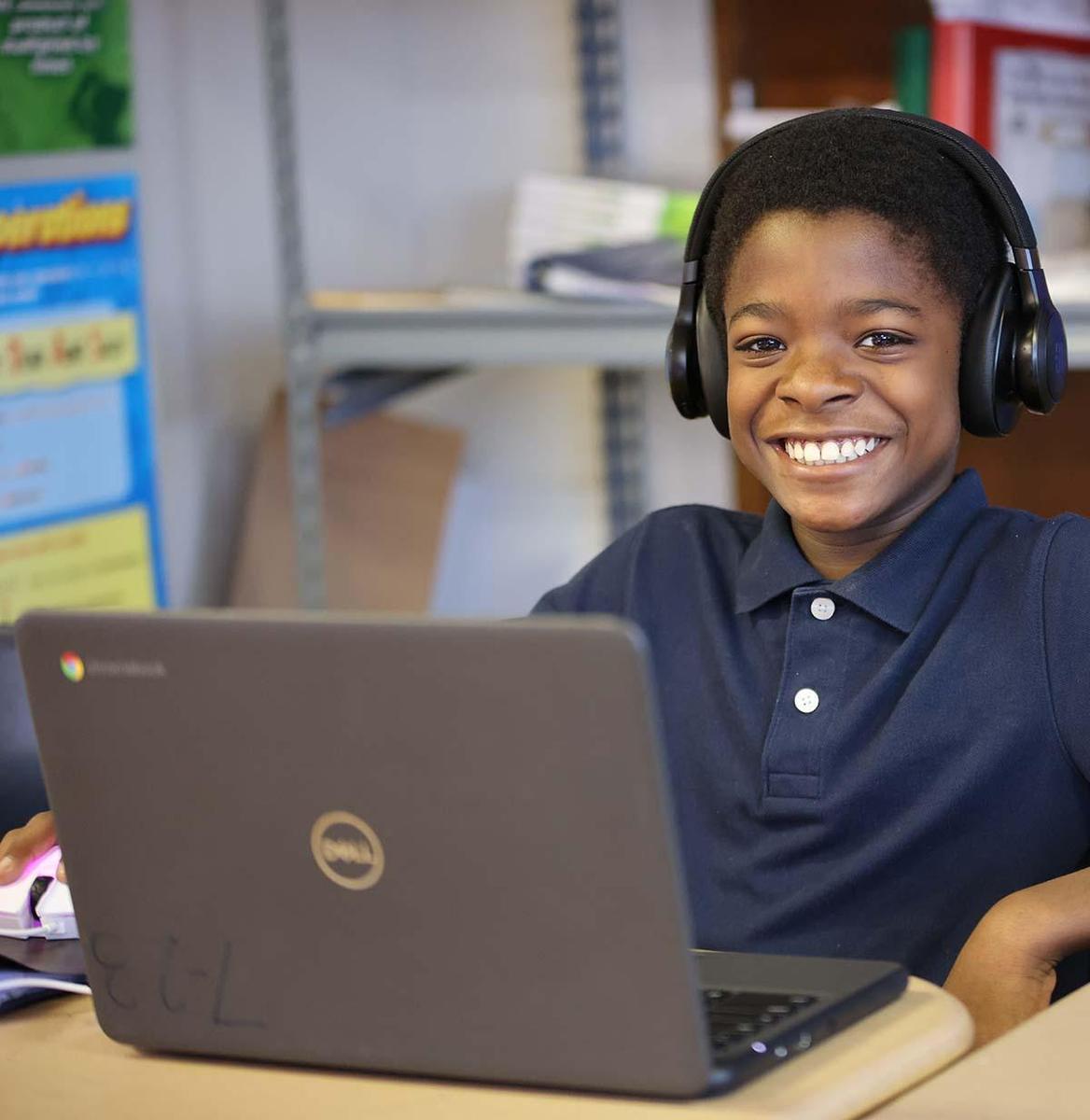 Student drawing in a classroom.