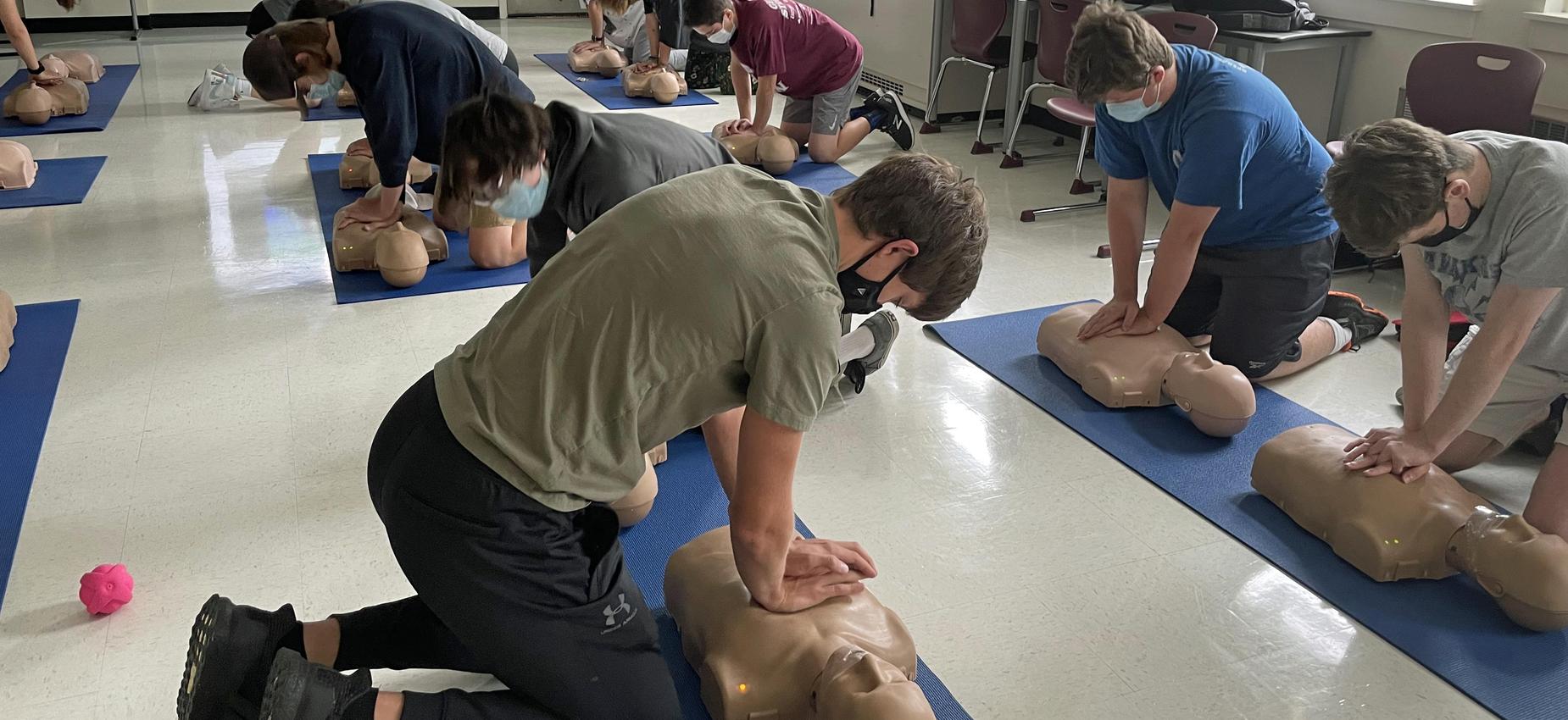 Students practicing CPR