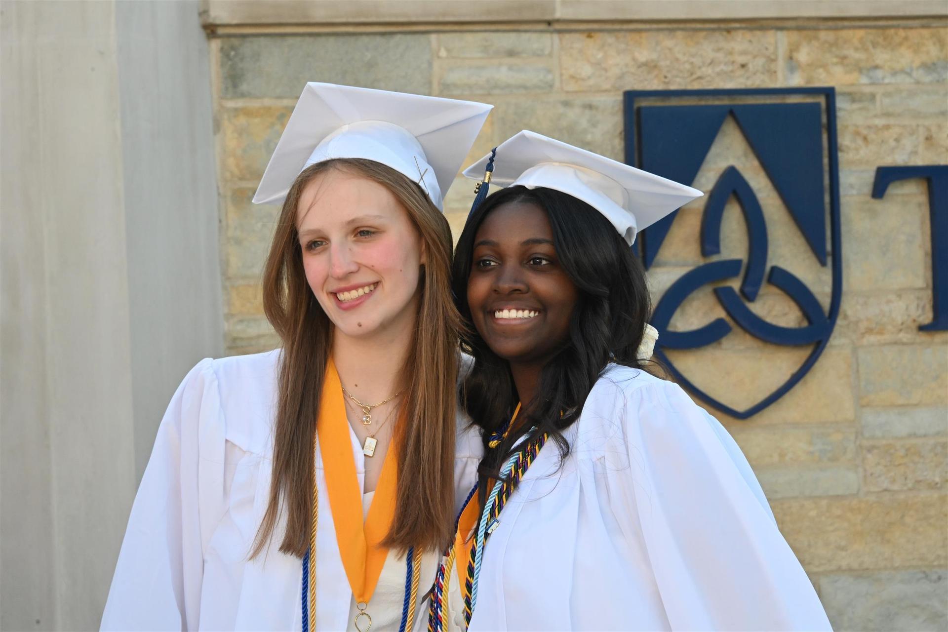  Graduates smiling together