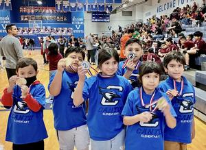 Special Olympics Students holding up metals