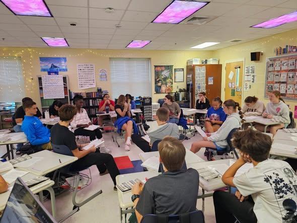 The students in Mrs. Rickett's 8th Grade ELA class engaged in a Socratic Seminar session discussing the surrounding themes pertaining to The Boy in the Striped Pajamas.