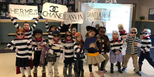 class of stuents dressed in french style outfits