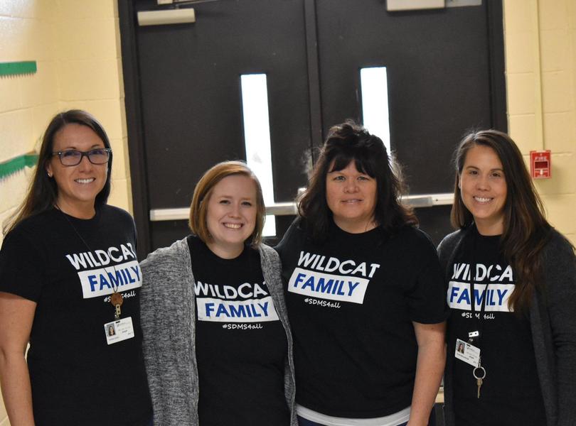 6th Grade Teachers posing in the hallway