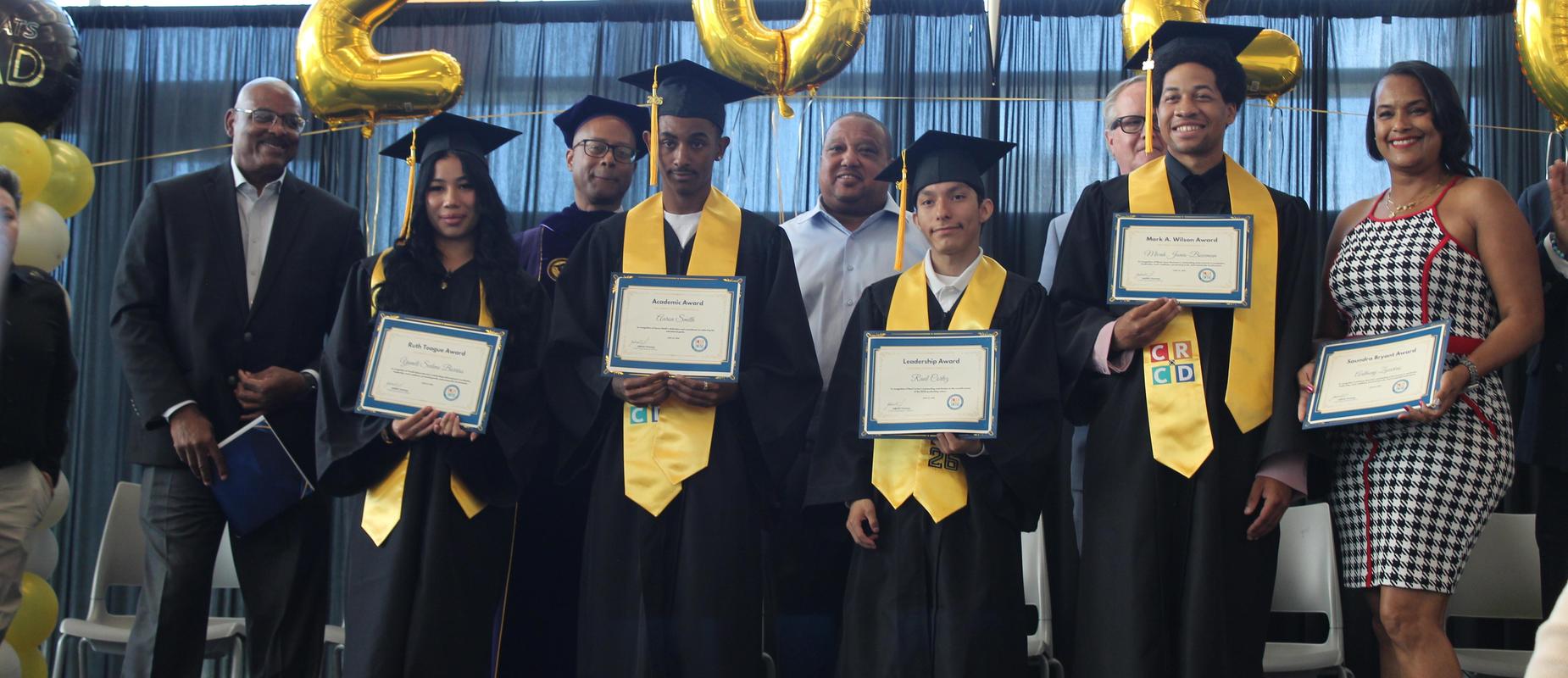 Graduates from South LA pose with their certificates