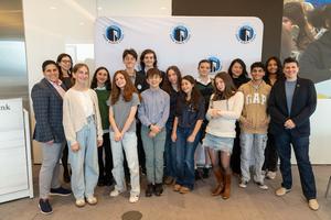 A group of students celebrating at the Urban Debate Tournament