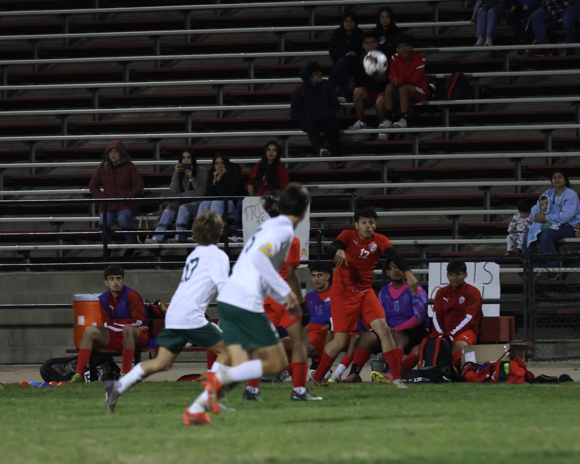 Varsity boys play soccer against Kingsburg