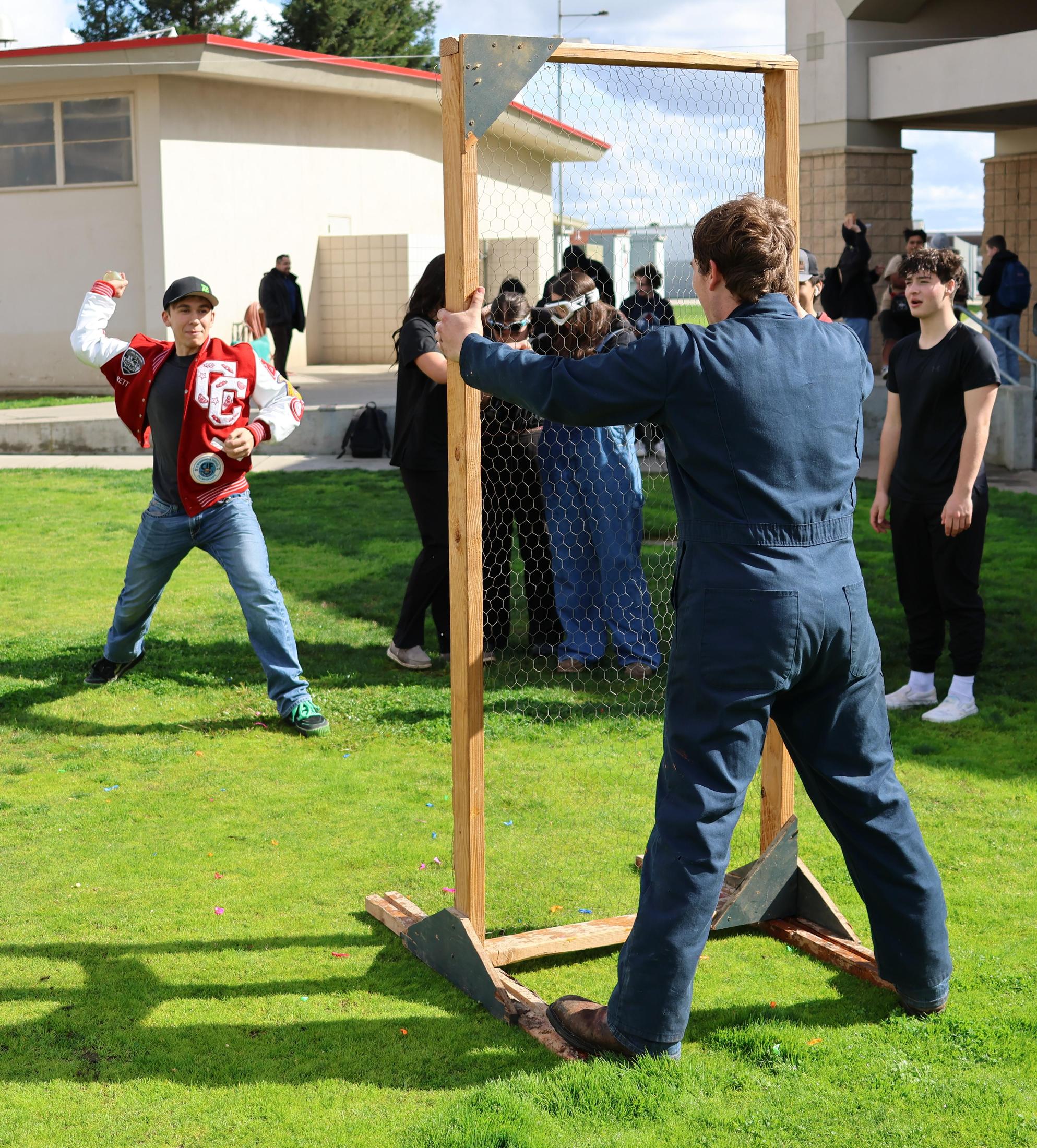 students and staff enjoying the water balloon toss