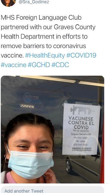 Photo shot of twitter post showing a Mayfield student with one of the fliers being posted around town.