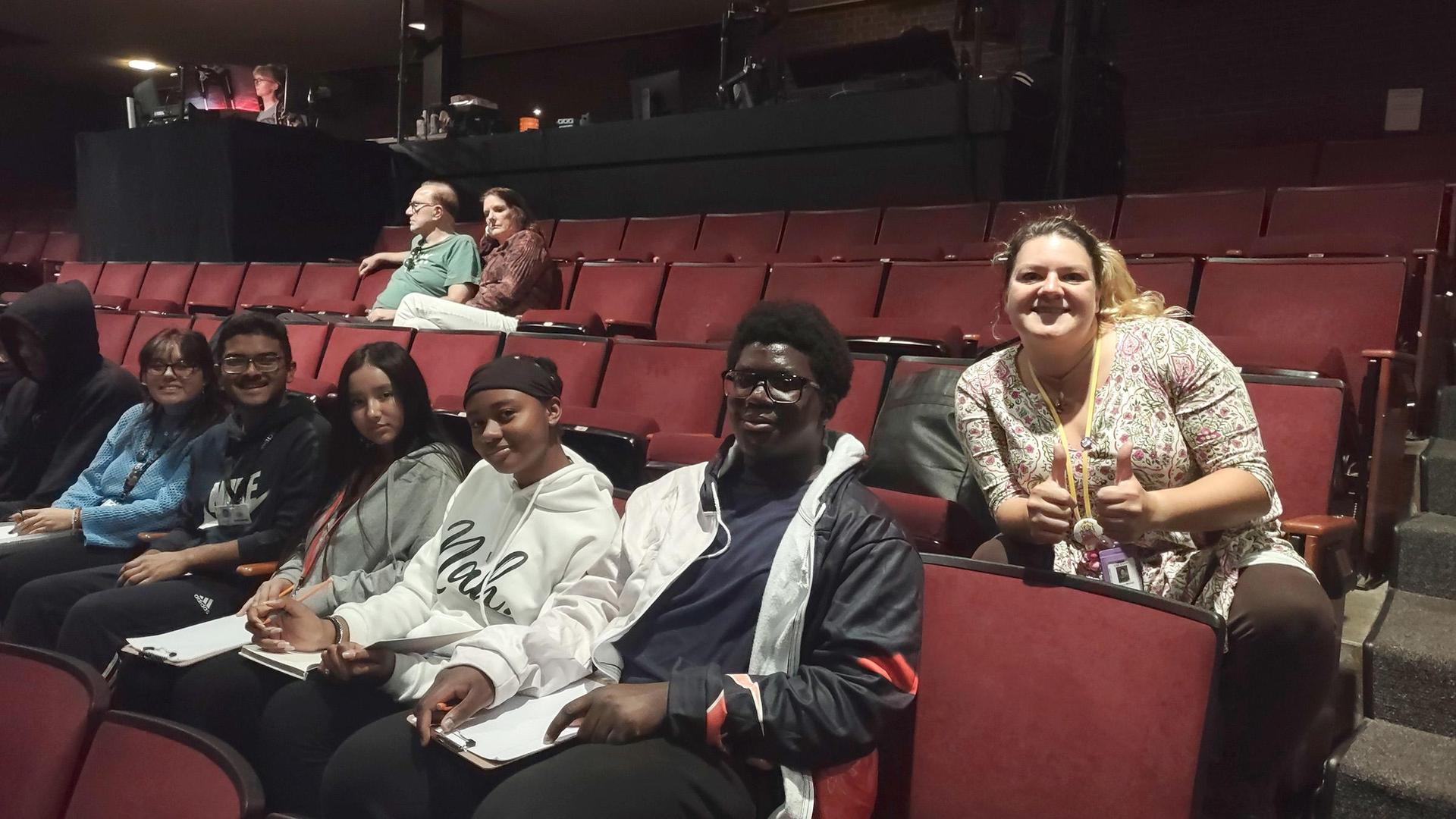 Students and staff inside a theater