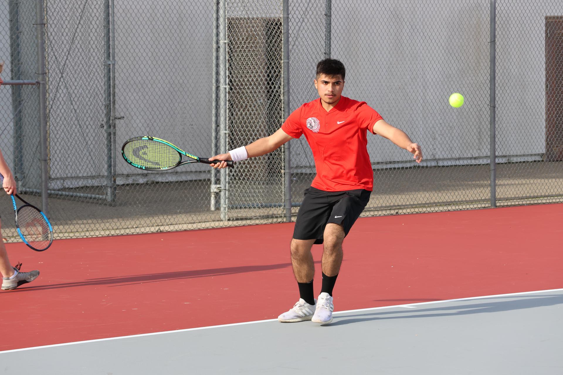 CUHS Boys playing tennis against coalinga