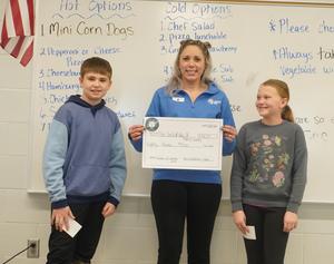 Students present their class check to the Barry County United Way.
