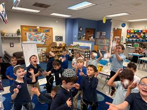 The kindergarten boys catch sight-words in their snowing sight word game!