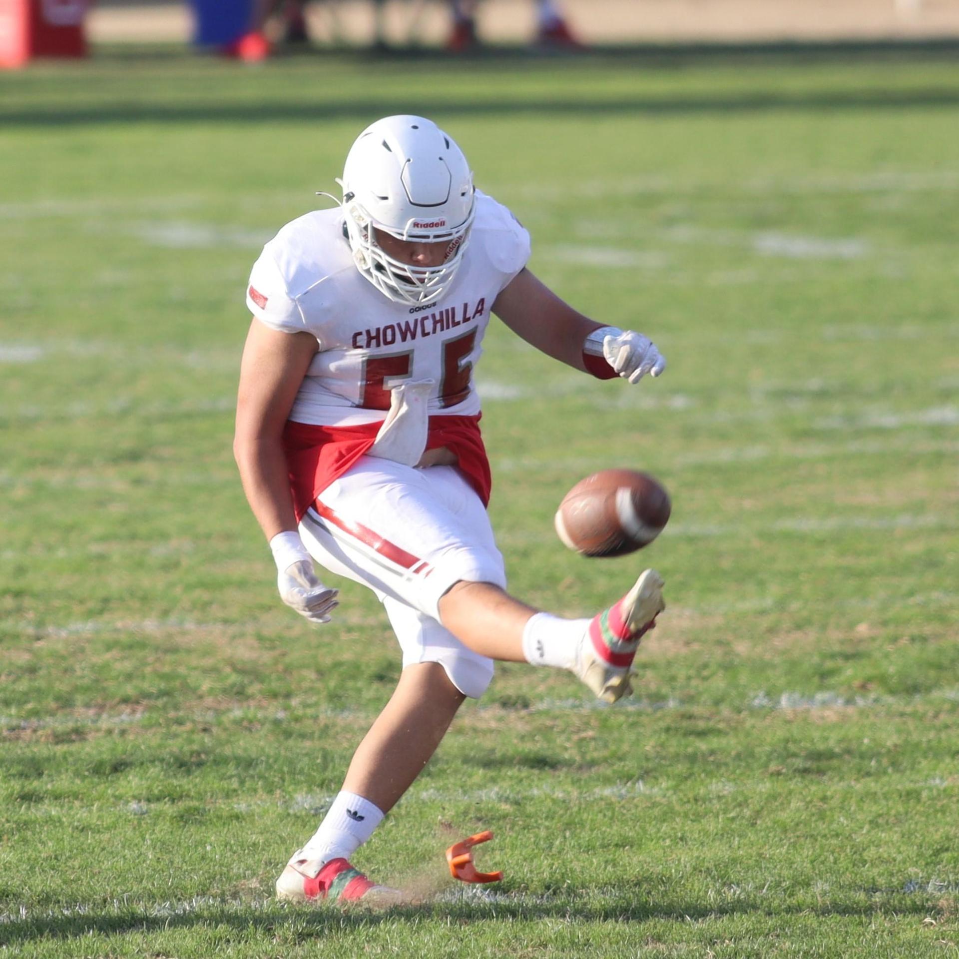 Junior Varsity football players in action against Caruthers