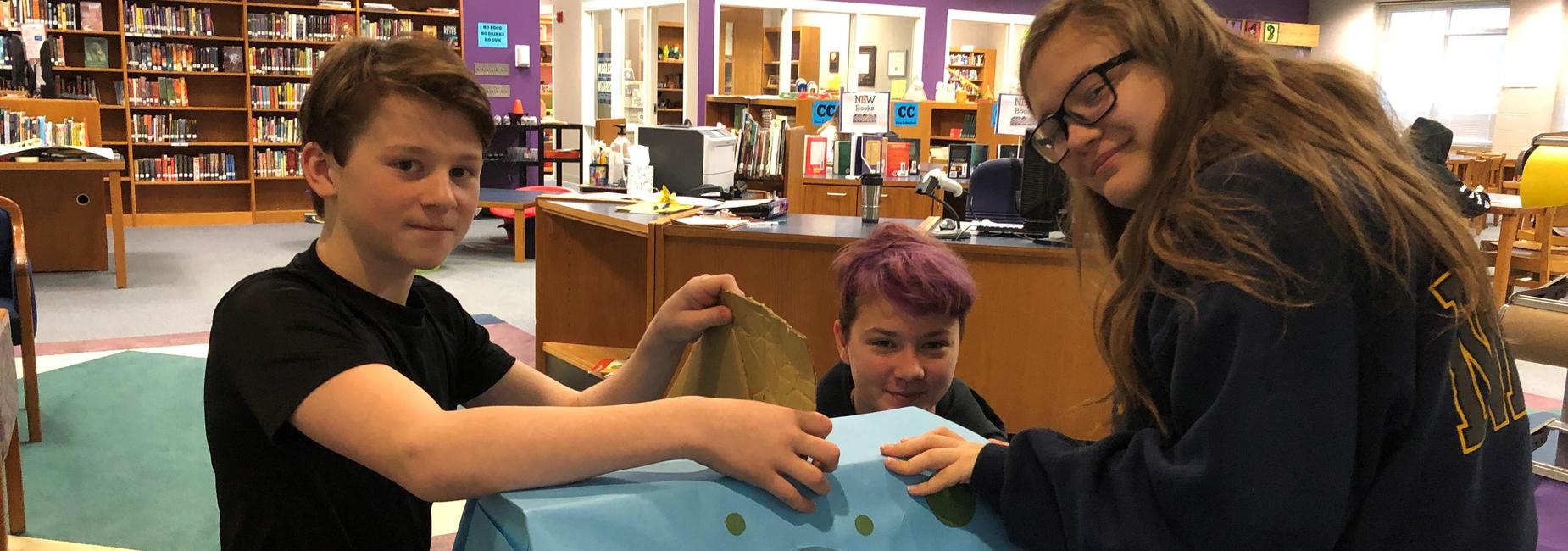 8th graders promote school recycling, with inviting disposal bins