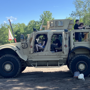 Students in a military vehicle