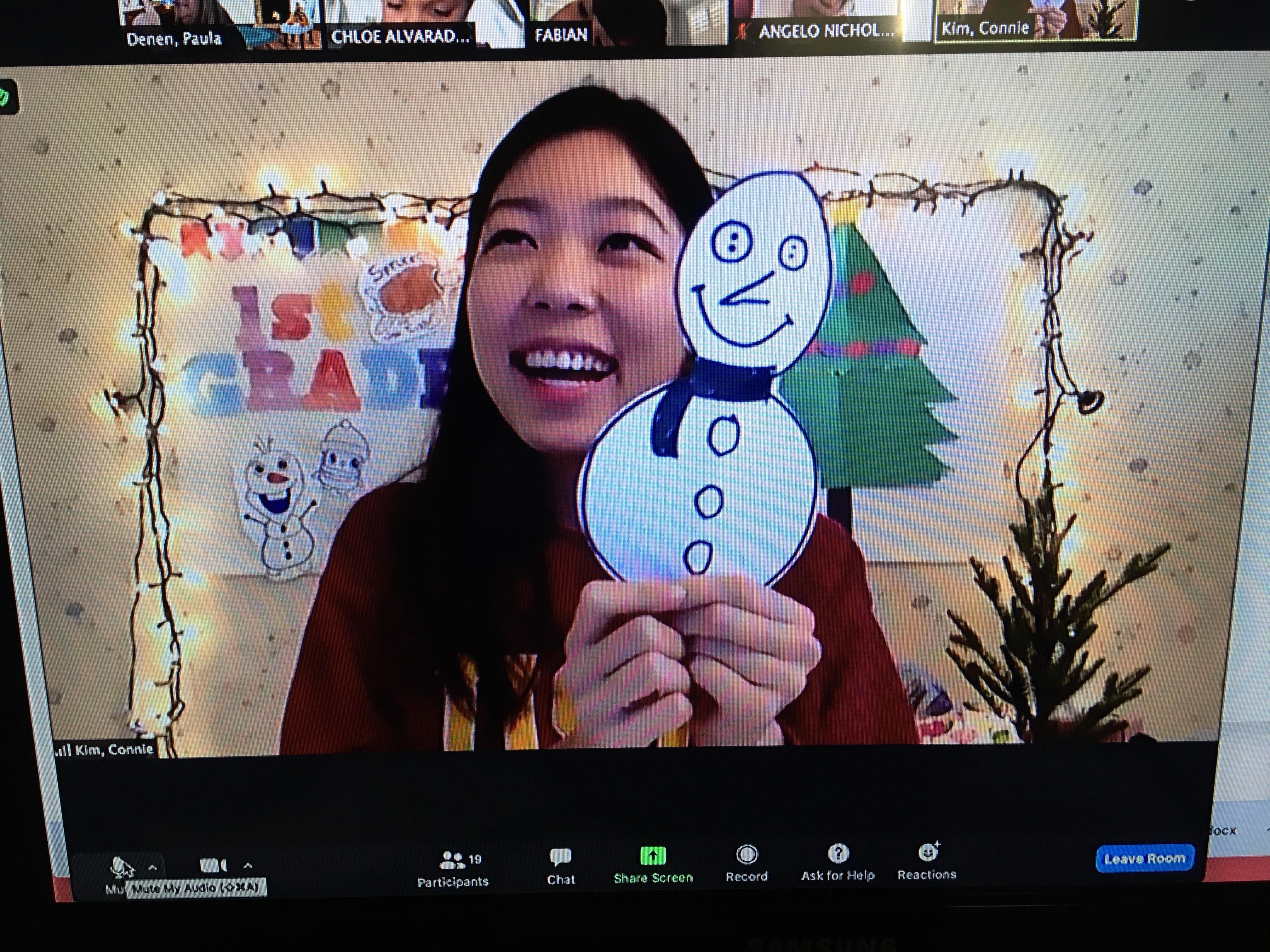 Ms. Kim makes snowman with first grade