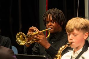 The 8th grade band performs