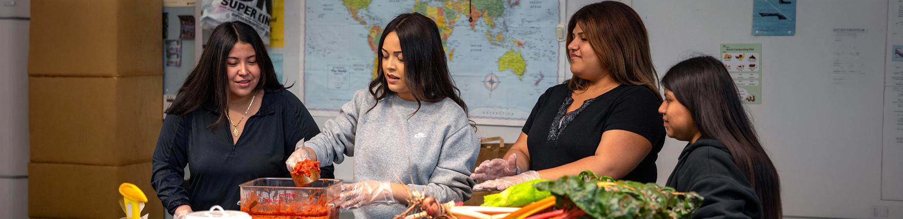 Four female students in cooking class