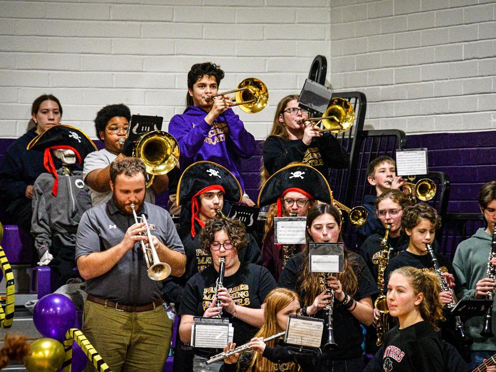 Band students playing their instruments.
