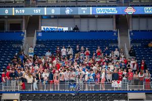 stands full of students at basketball game decked our in red, white and blue