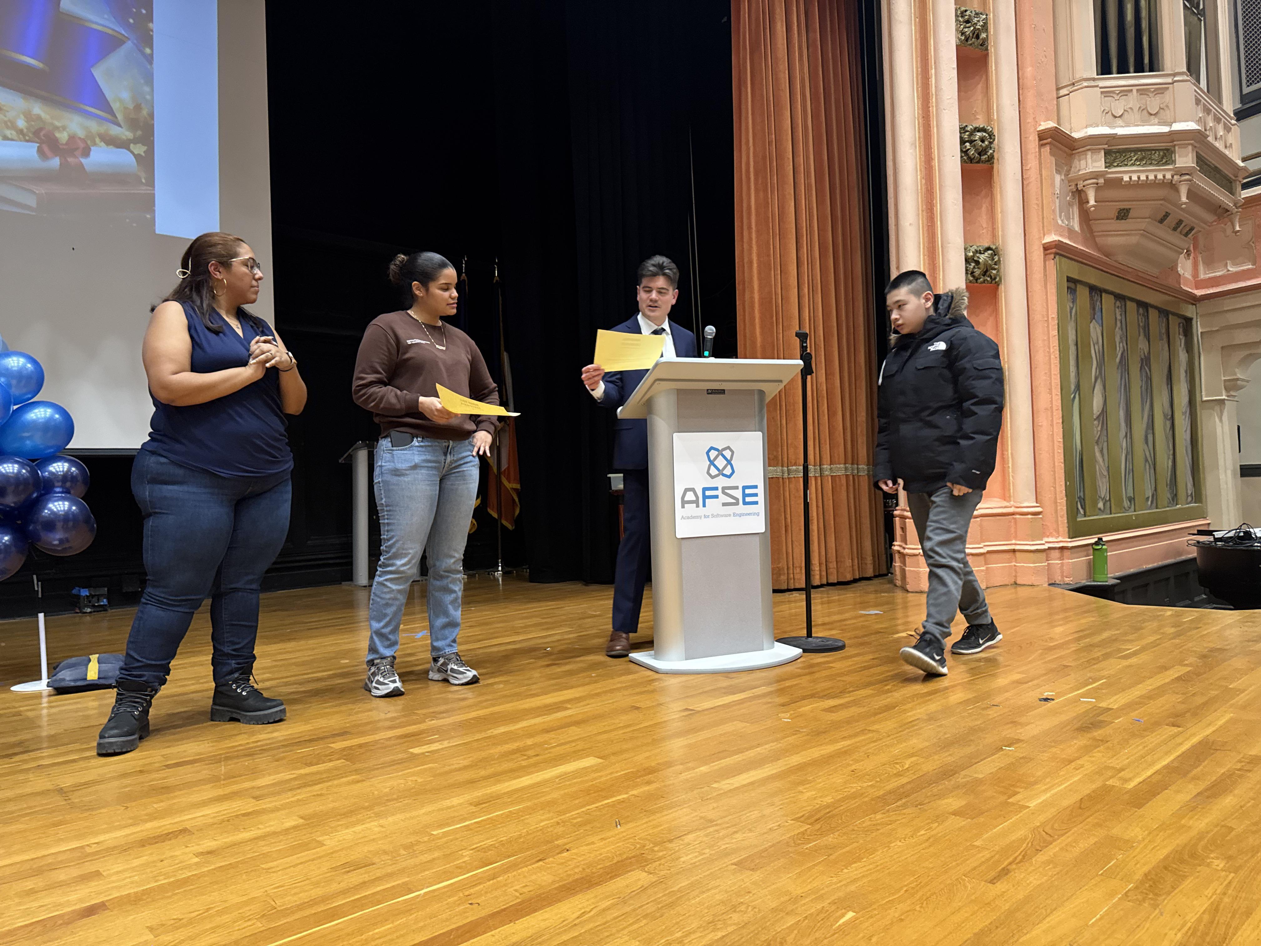 Students participate in a ceremony at the Academy for Software Engineering.