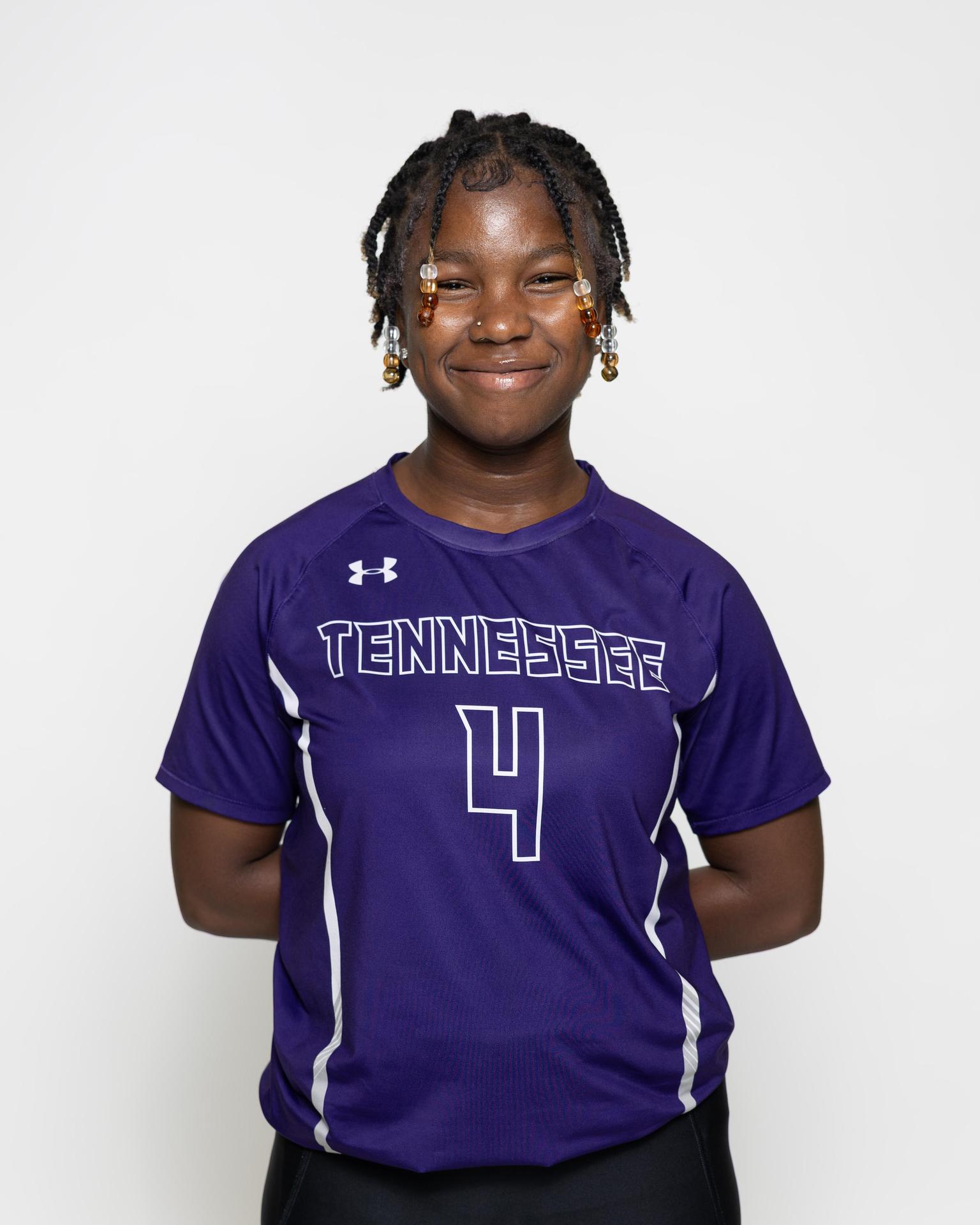 number 6 female volleyball player posing 