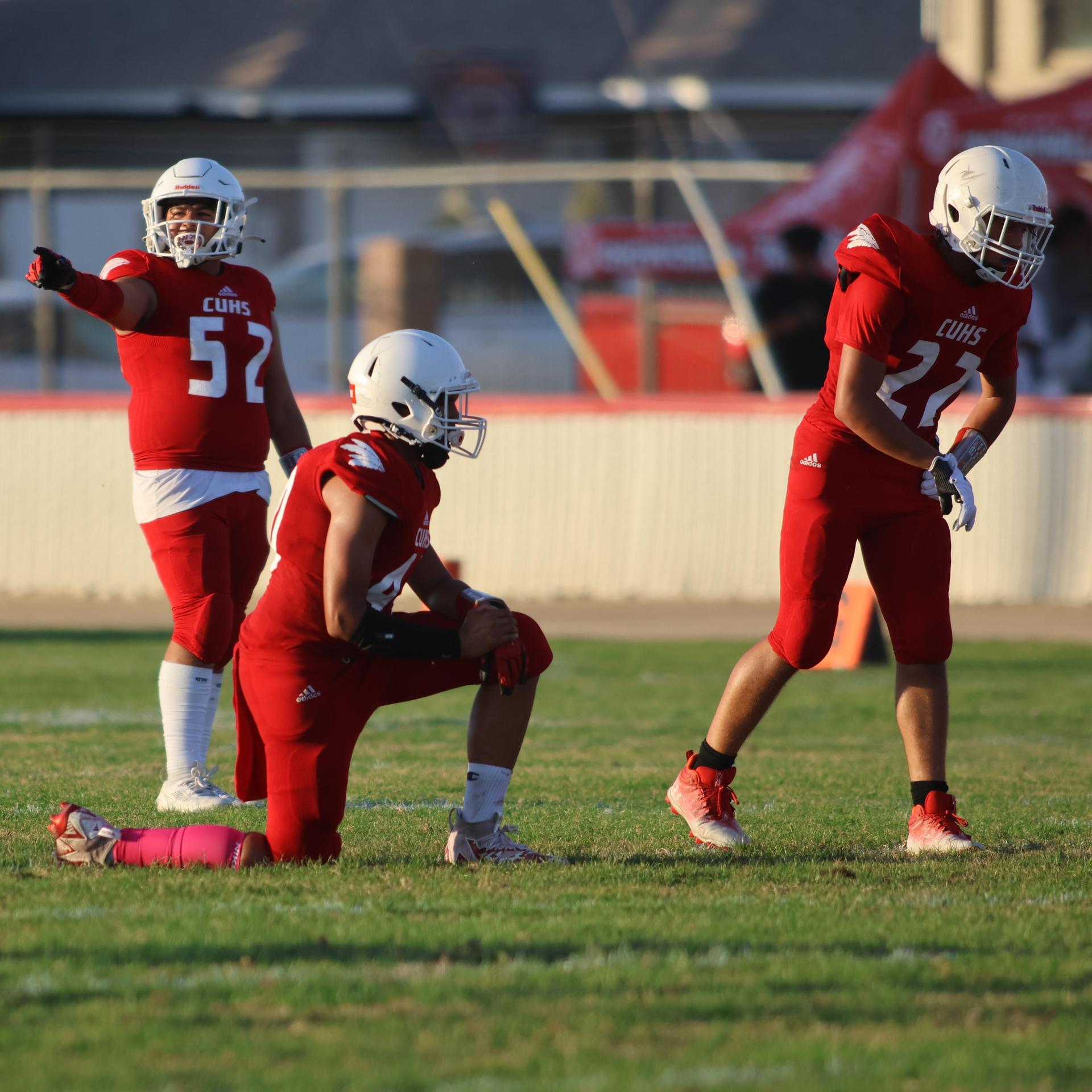 junior varsity football players in action against Fowler
