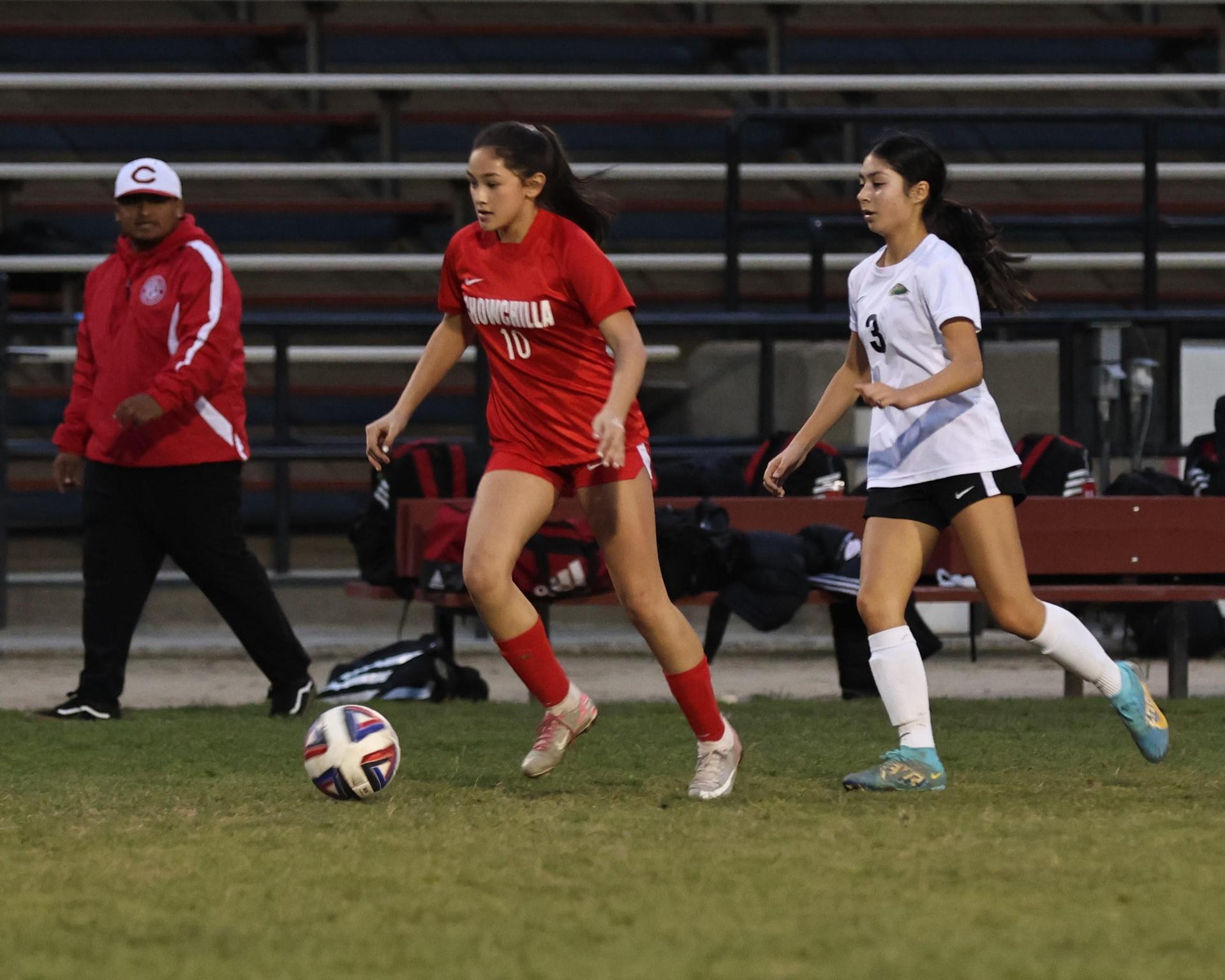 Junior varsity girls playing soccer against liberty