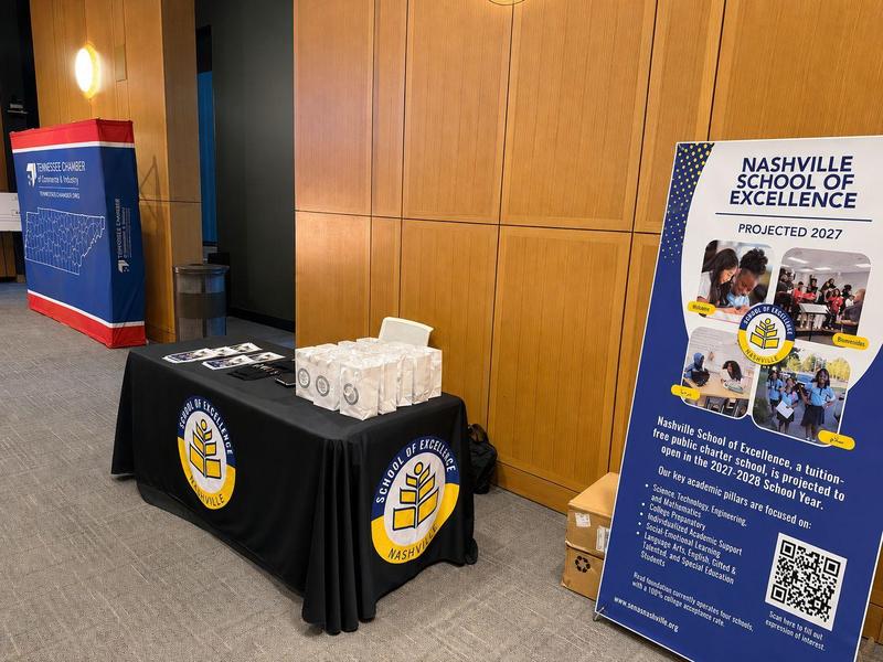 Nashville School of Excellence's exhibit booth featuring school information, promotional materials, and a banner at the 2026 National Civics Bee.