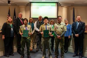 Matthew Norris and Joshua McPeak are joined by the Prince George County School Board after the pair were recognized for earning Eagle Scout within the Boy Scouts of America.
