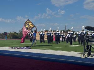 The Wildcat Band flag corps performs at the UIL Region 8 Marching contest