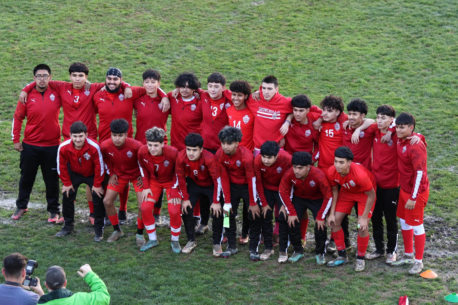 boys varsity soccer team players posing
