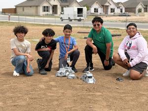 Ridgewood Storm Chasers pose together on playground