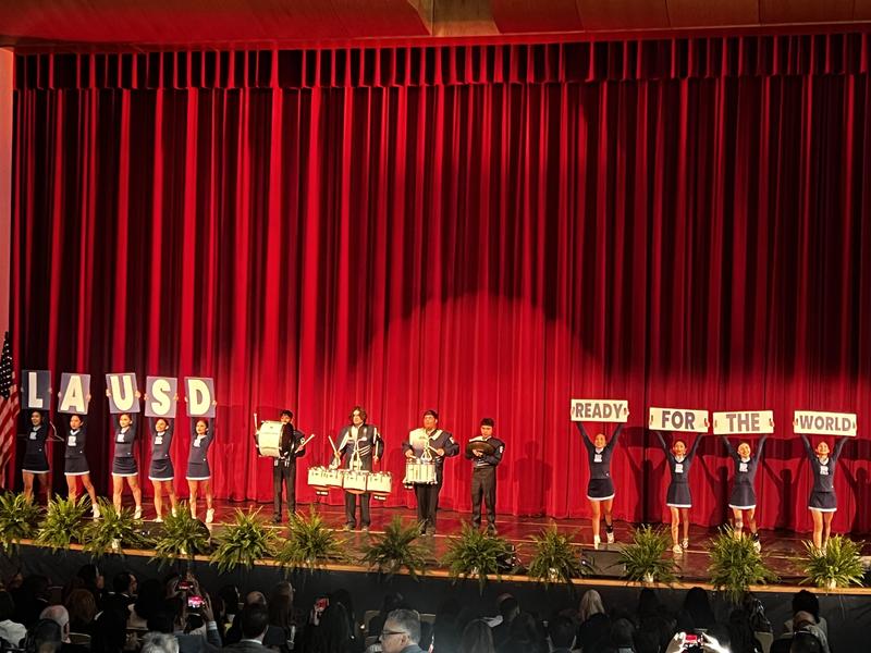 Cheerleaders & drumline on stage.