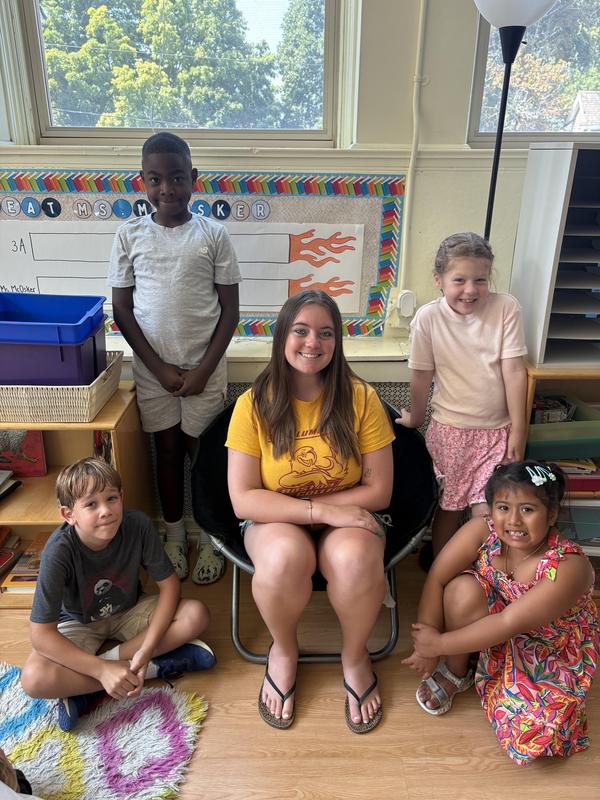 Ms. Bane with four students from the summer program at STCPS.