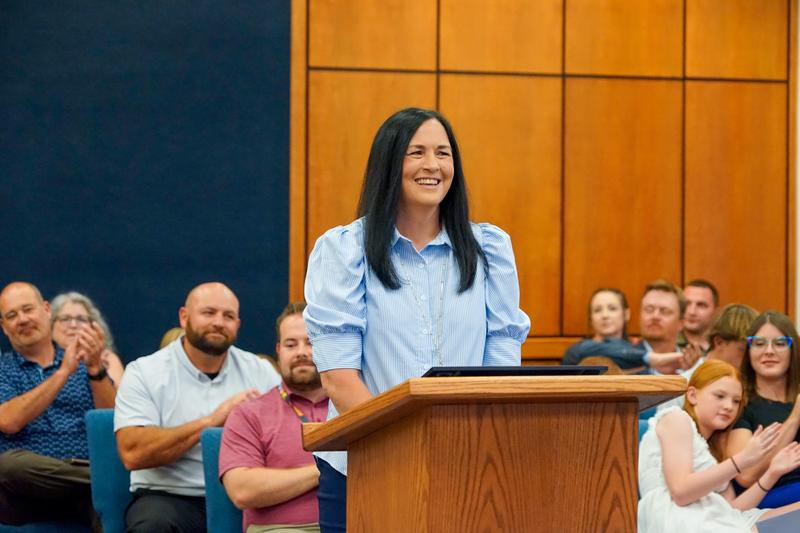 Cassandra Slayton at the podium during the board meeting.