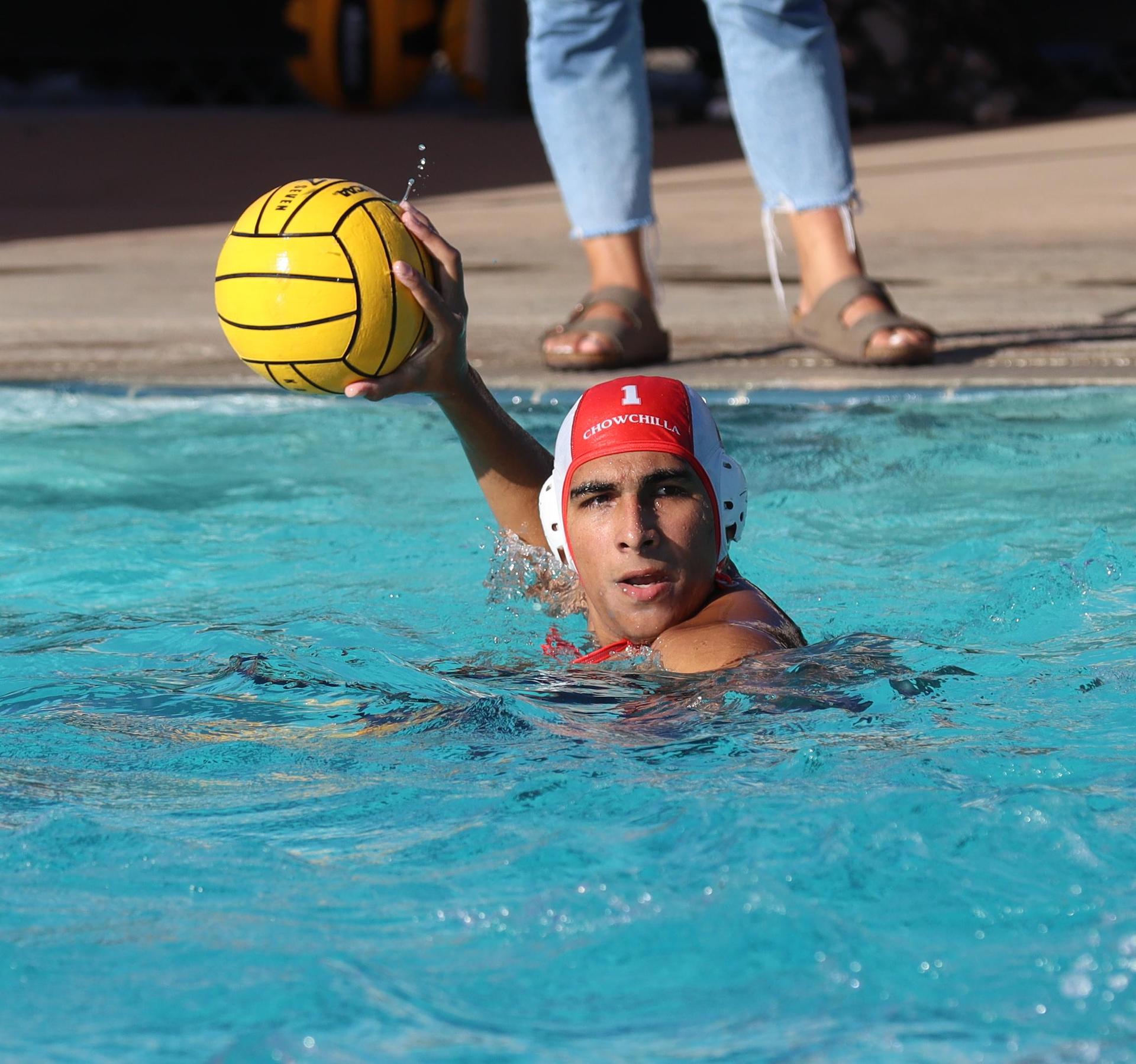 boys water polo players in action against san joaquin memorial
