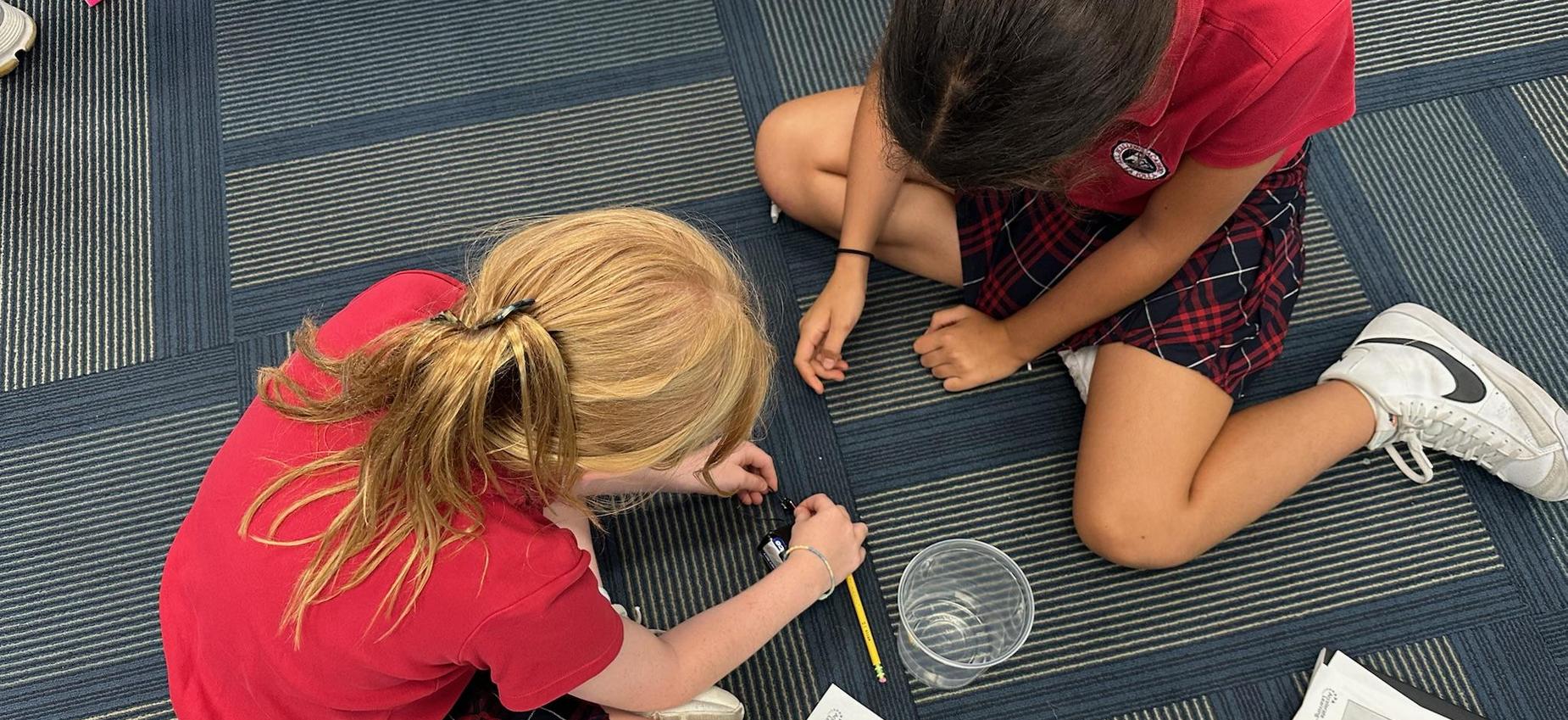3rd grade students conducing science experminet with lima beans