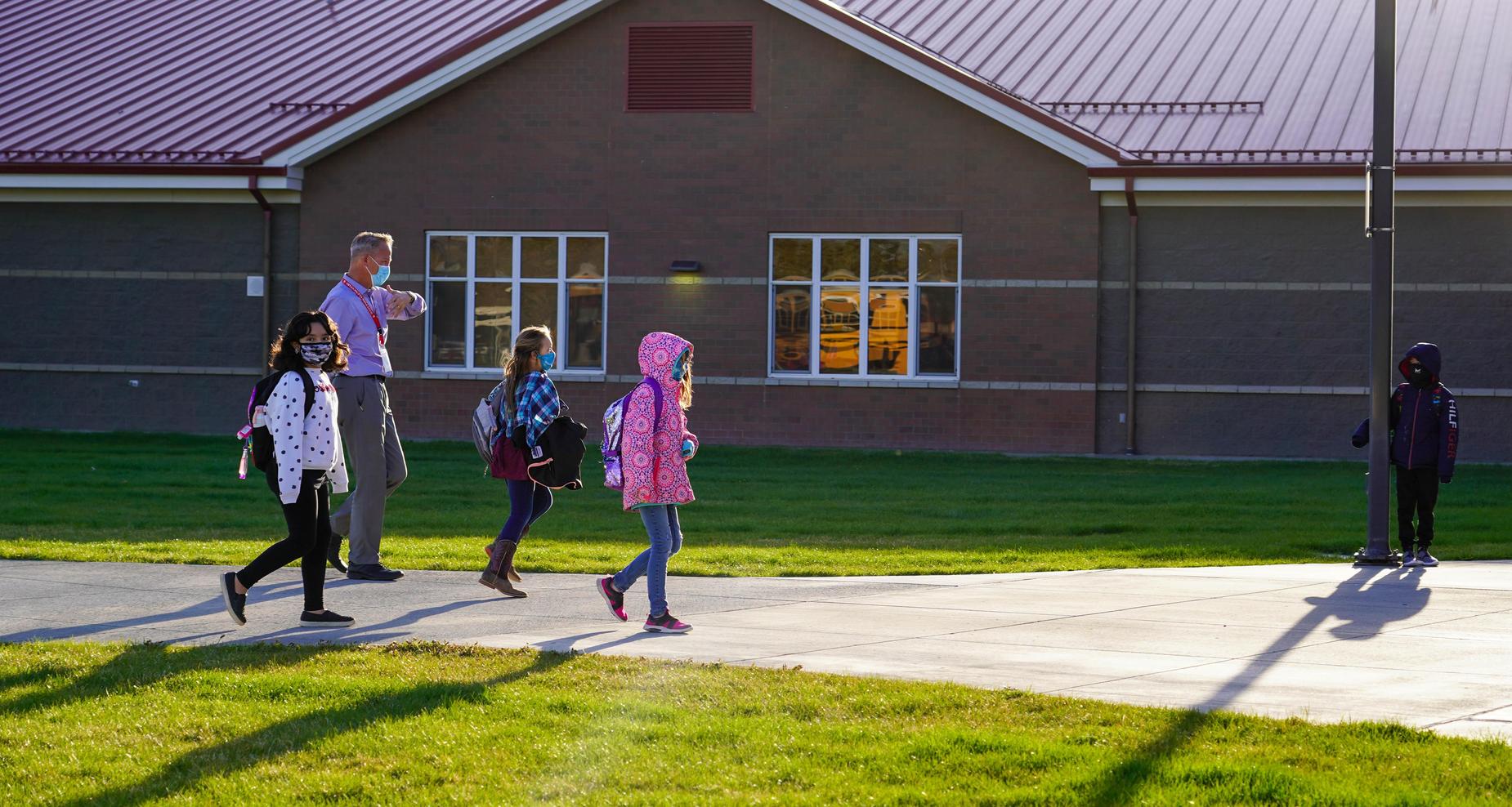 West Park principal walking with students.