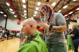 People shaving heads for cancer research