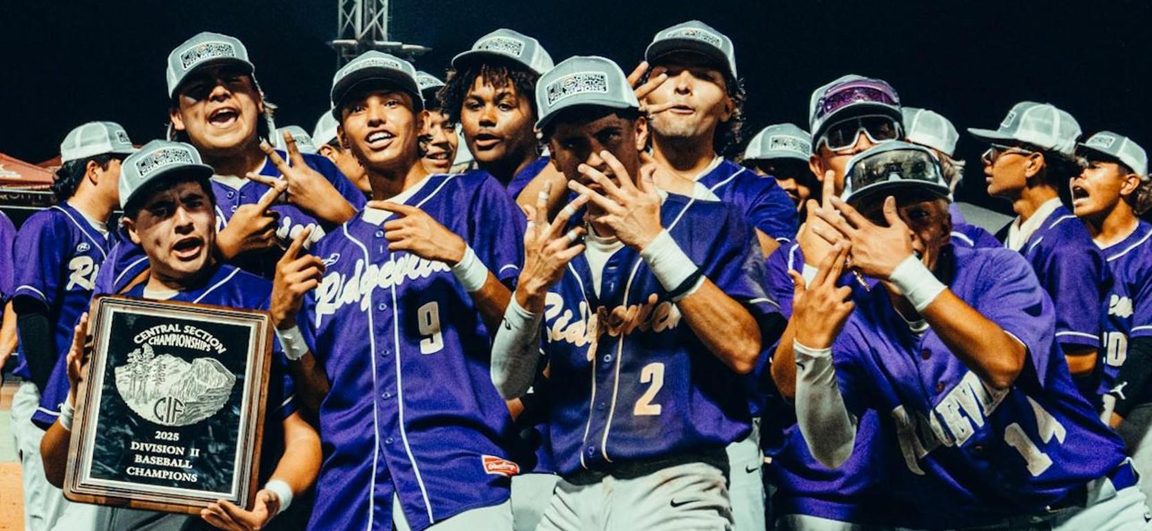 A group of baseball players celebrating with a championship plaque and striking poses.