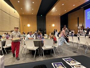 Attendees gather at the 2026 National Civics Bee as Nashville School of Excellence shares information about its planned STEM-focused public charter school.