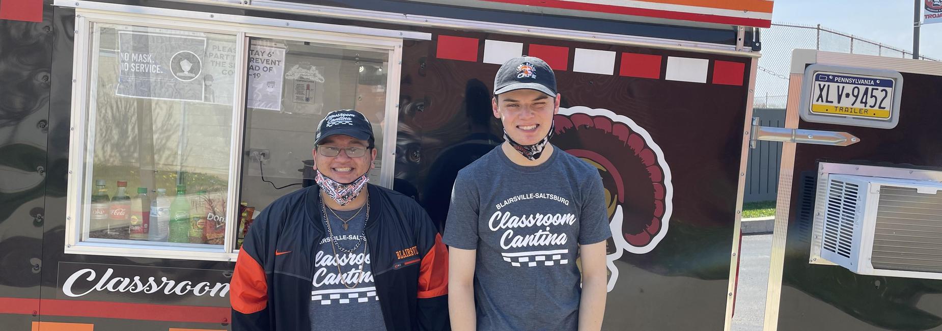 students in front of food truck