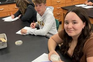 9th-graders Kiera Mann, Michael Madigan, and Annabelle Mason verify data to be graphed
